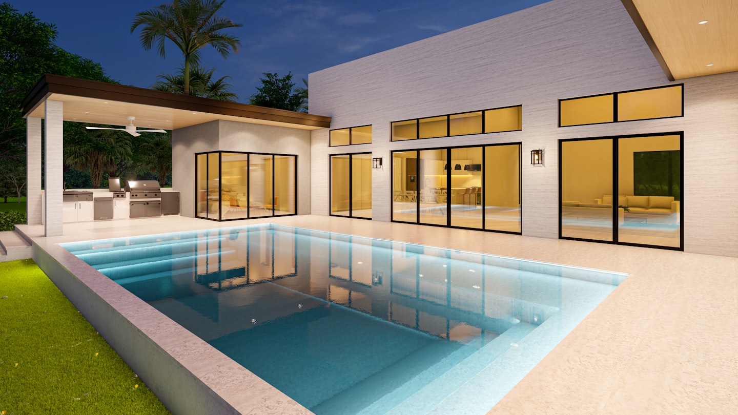 Modern luxury pool with clear water, surrounded by a well-designed outdoor area featuring a grill station and large glass doors, reflecting the inviting ambiance of a Texas backyard.